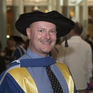 Dr Rob Stanton at his October 2015 graduation ceremony at Parliament House