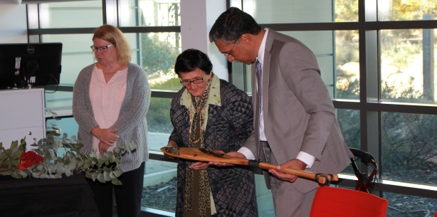 Aunty Agnes Shea and Professor Deep Saini examining the gift from the Whanganui Health Board