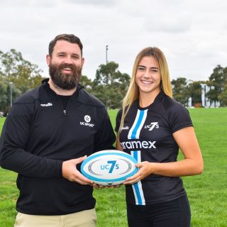 Coach Liam and player Brooke with ball