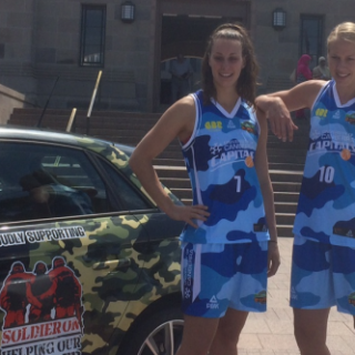 UC Capitals players Abby Bishop and Stephanie Talbot show off their one-off kit for their clash against West Coast. Photo supplied.