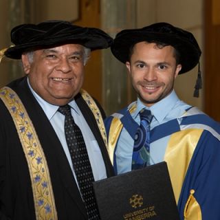 Raglan Maddox with UC Chancellor Professor Tom Calma following Dr Maddox's graduation