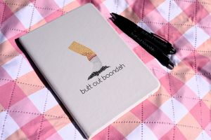 Notebook and pens which says Butt out boondah