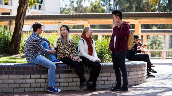 students sitting together on campus