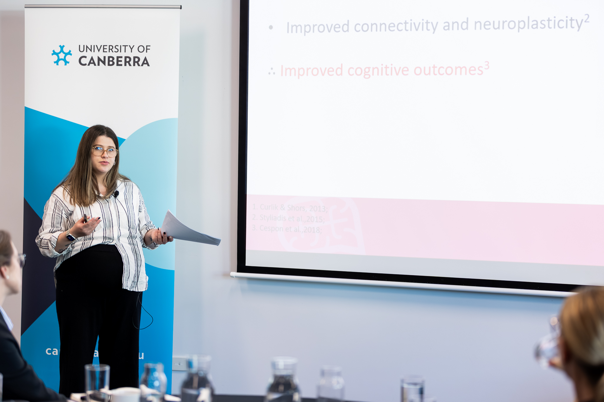women presenting at front of room