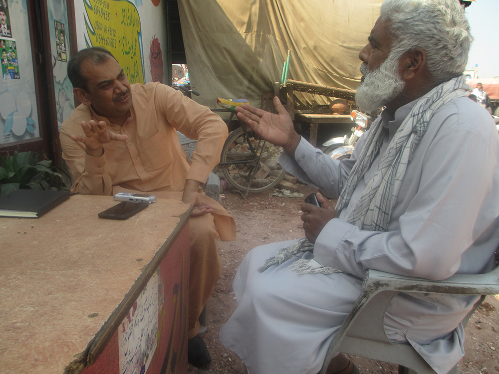 Nadeem Akmal in Pakistan chatting to a farmer