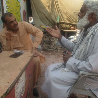 Nadeem Akmal in Pakistan chatting to a farmer