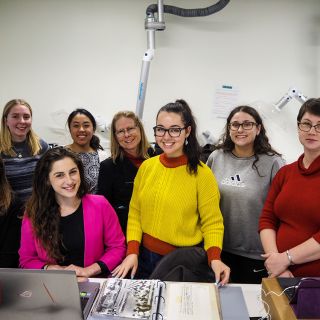 Students in the cultural heritage and conservation lab working on the photo collection