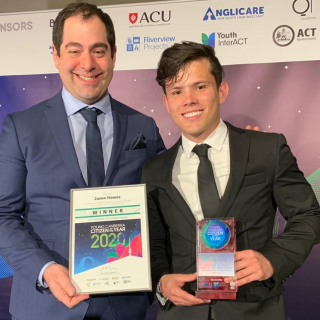 Jason receiving his award