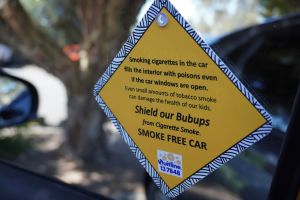 Car suction placard which says Smoking cigarettes in the car fills the interior with poisons even if the car windows are open. Even small amounts of tobacco smoke can damage the health of our kids. Shield our Bubups from cigarette smoke. Smoke free car.