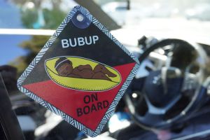 Car suction placard with image of a sleeping baby which says Bubup on board