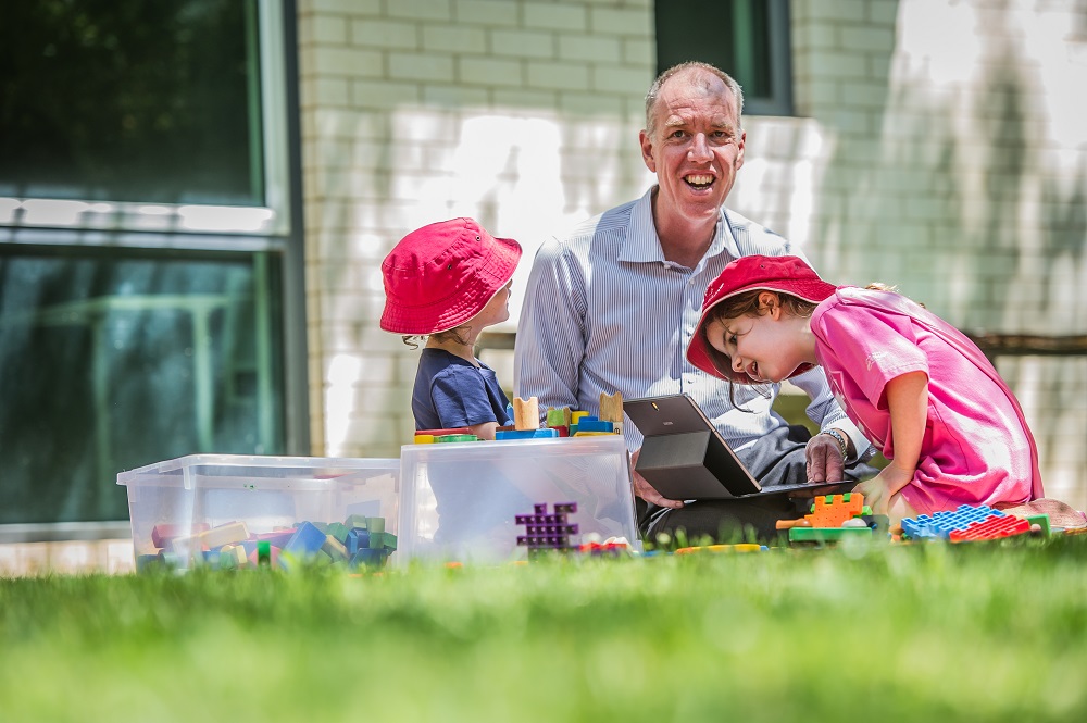 Tom Lowrie with early learning students