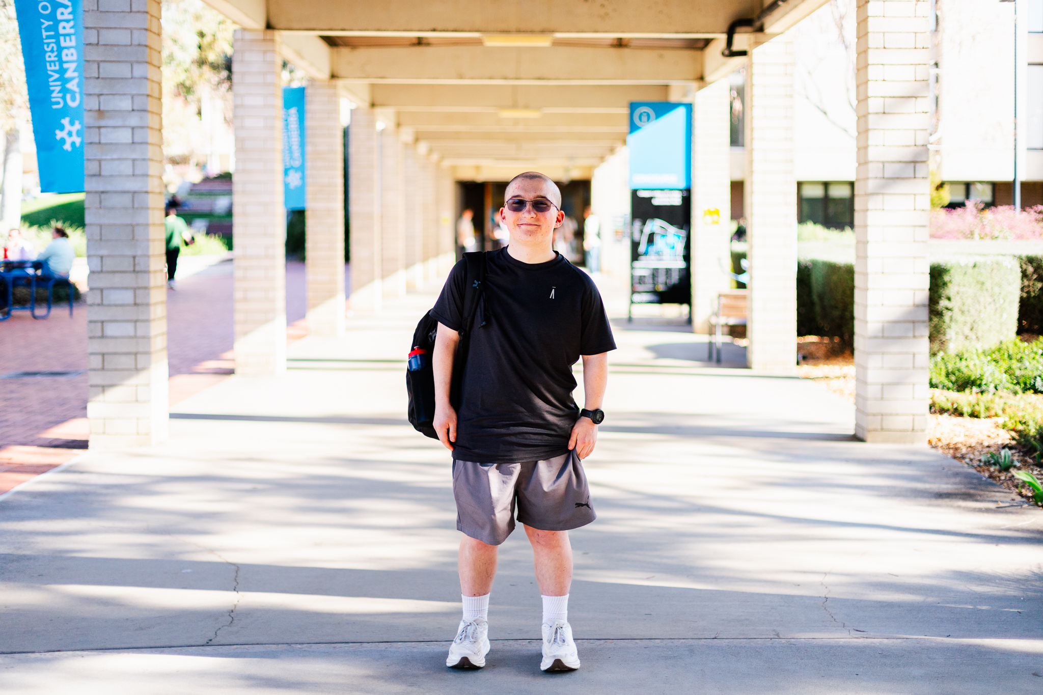 Man standing between two pillars