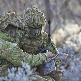 Image of two soldiers in the field
