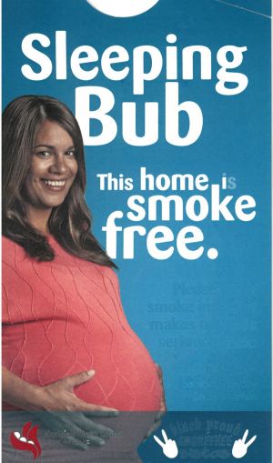 A door hanger which says Sleeping bub. This home is smokefree. Please don't smoke inside, it makes our kids seriously sick