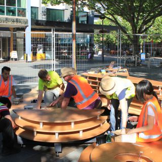 University staff and students install the Pavilion X project at Canberra's Garema Place.