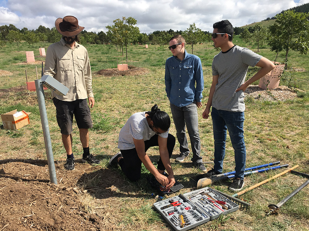 A team of engineers from UC install a soil moisture monitoring system at the Arboretum