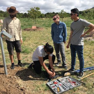 A team of engineers from UC install a soil moisture monitoring system at the Arboretum