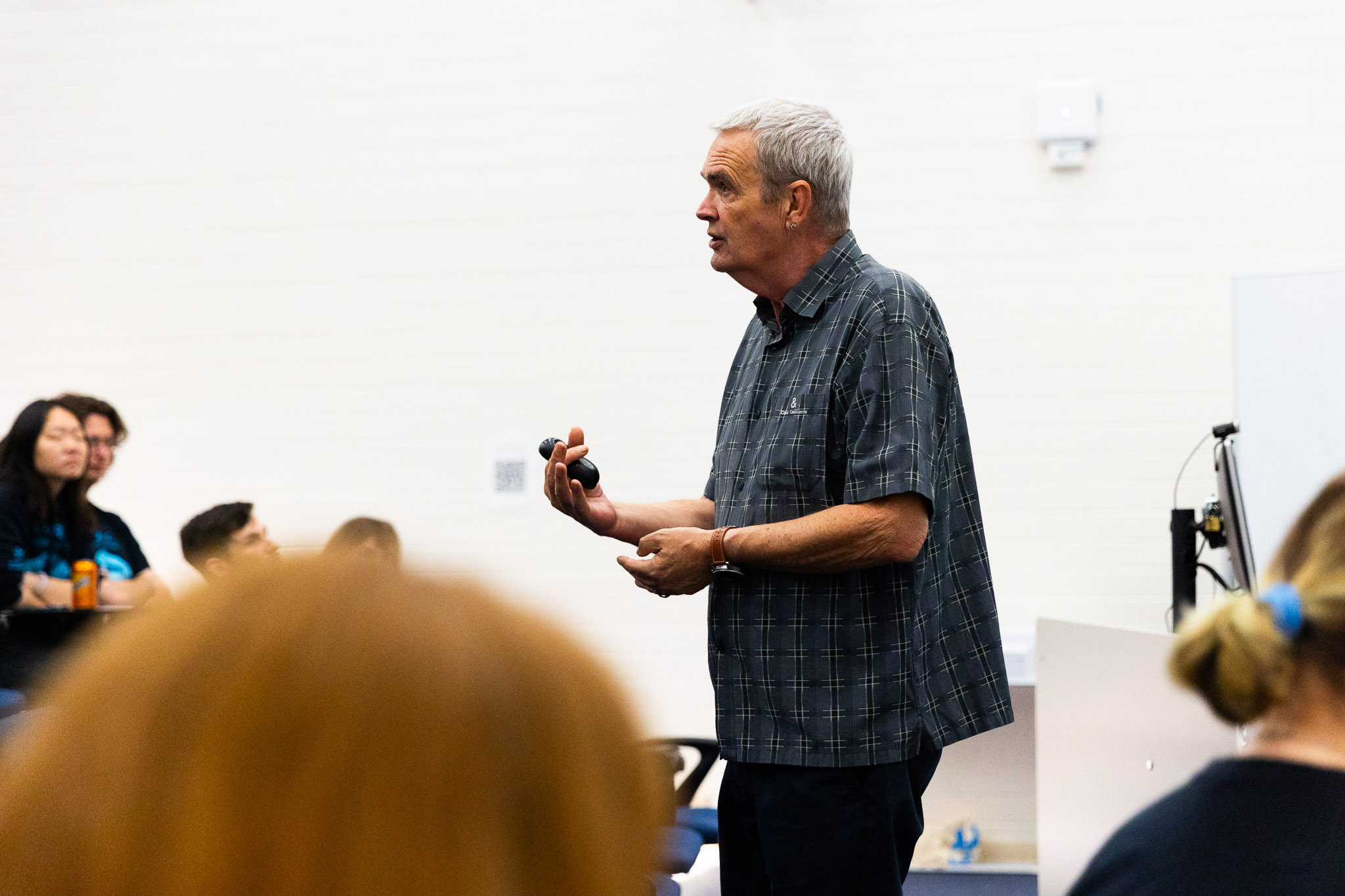 Man presenting to full classroom