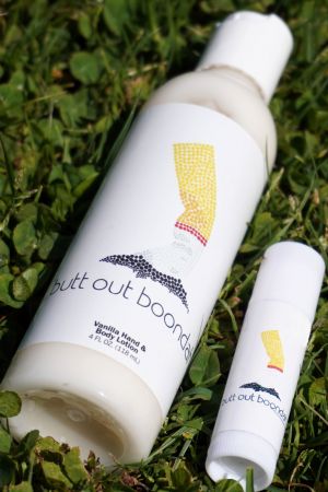 Lip balm, lotion and hand sanitiser which says Butt out boondah
