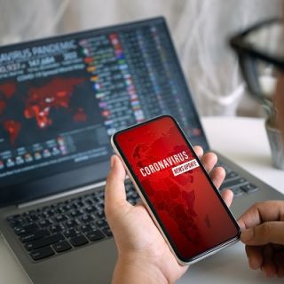 Man looking at news on phone