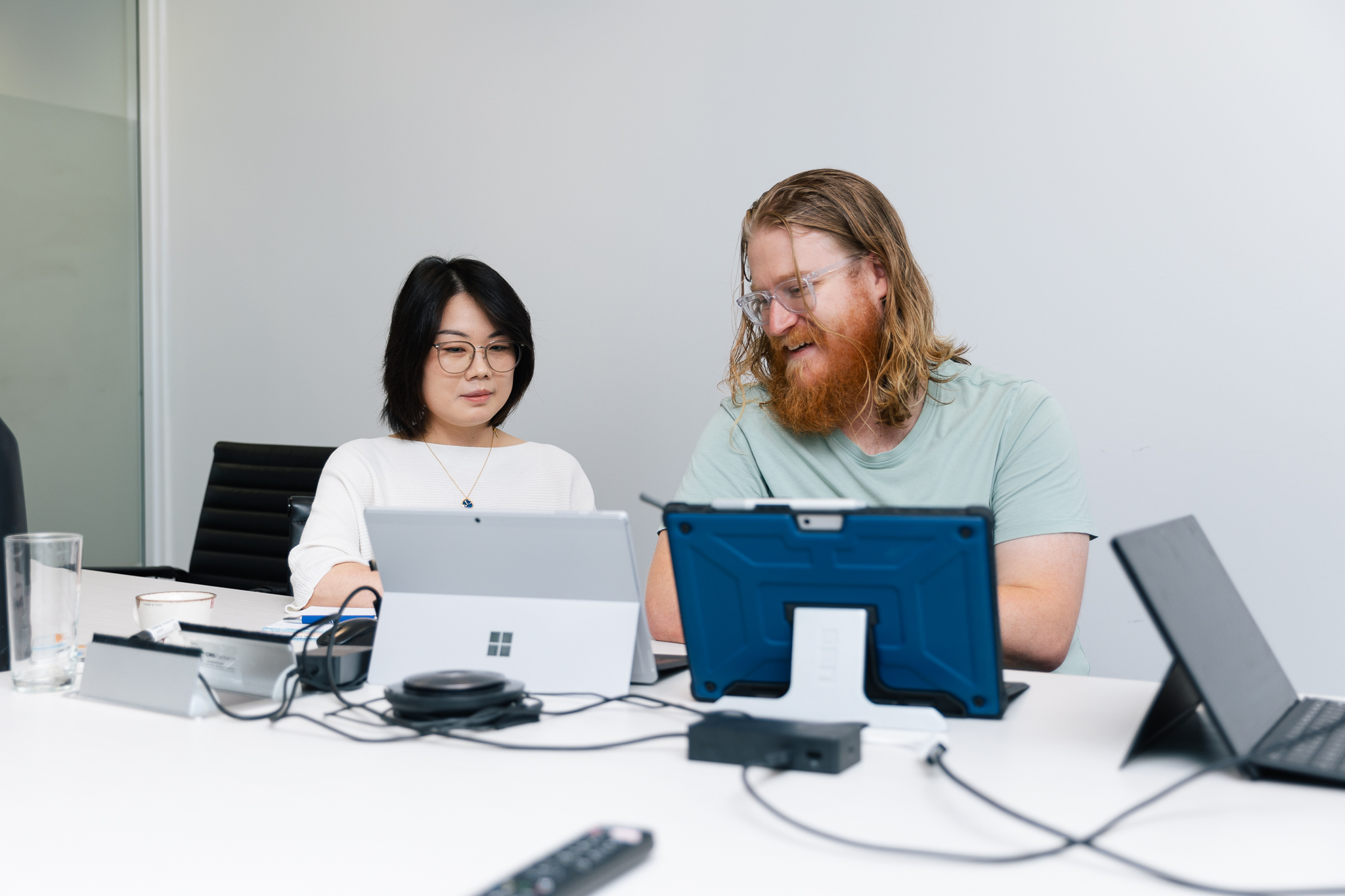 Staff members working on laptops