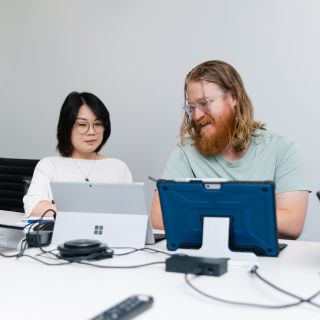 Staff members working on laptops