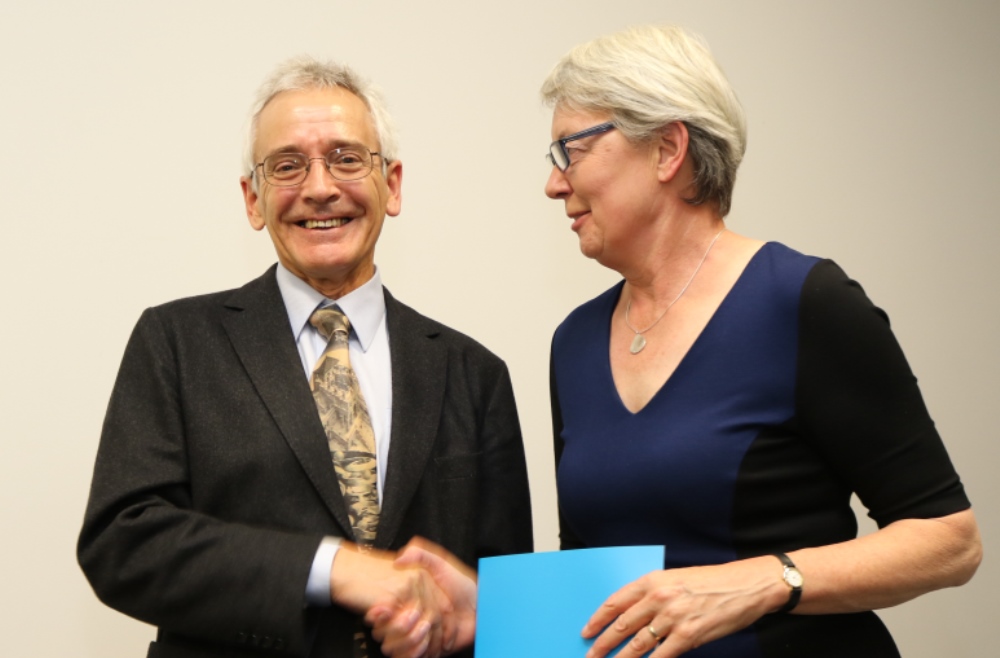 Centenary Professor John Dryzek accepts his award from DVC R&I Frances Shannon