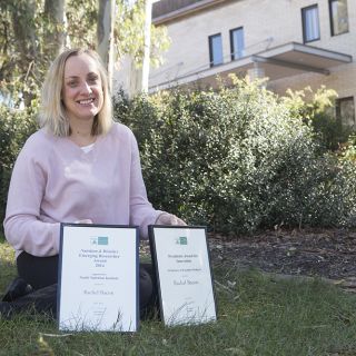 Rachel Bacon pictured with her two Dietitians Association of Australia awards