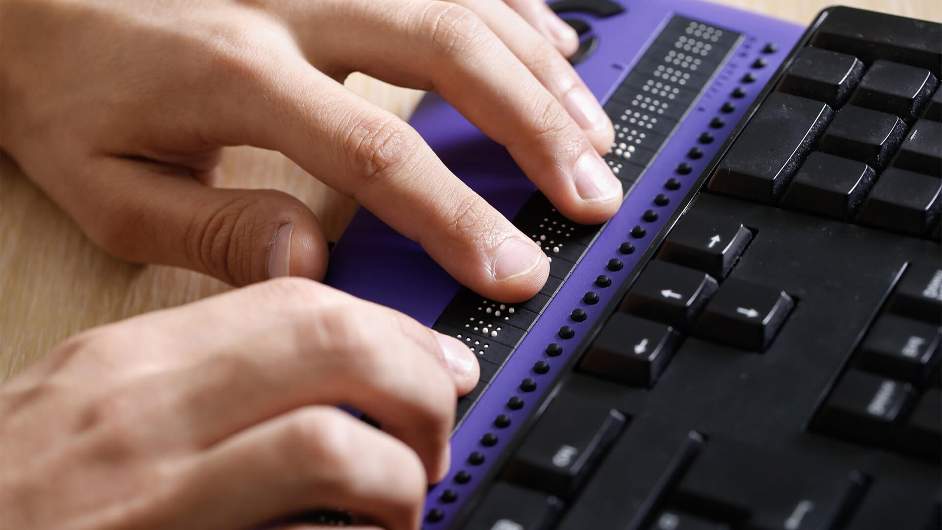 A person using a braille computer display