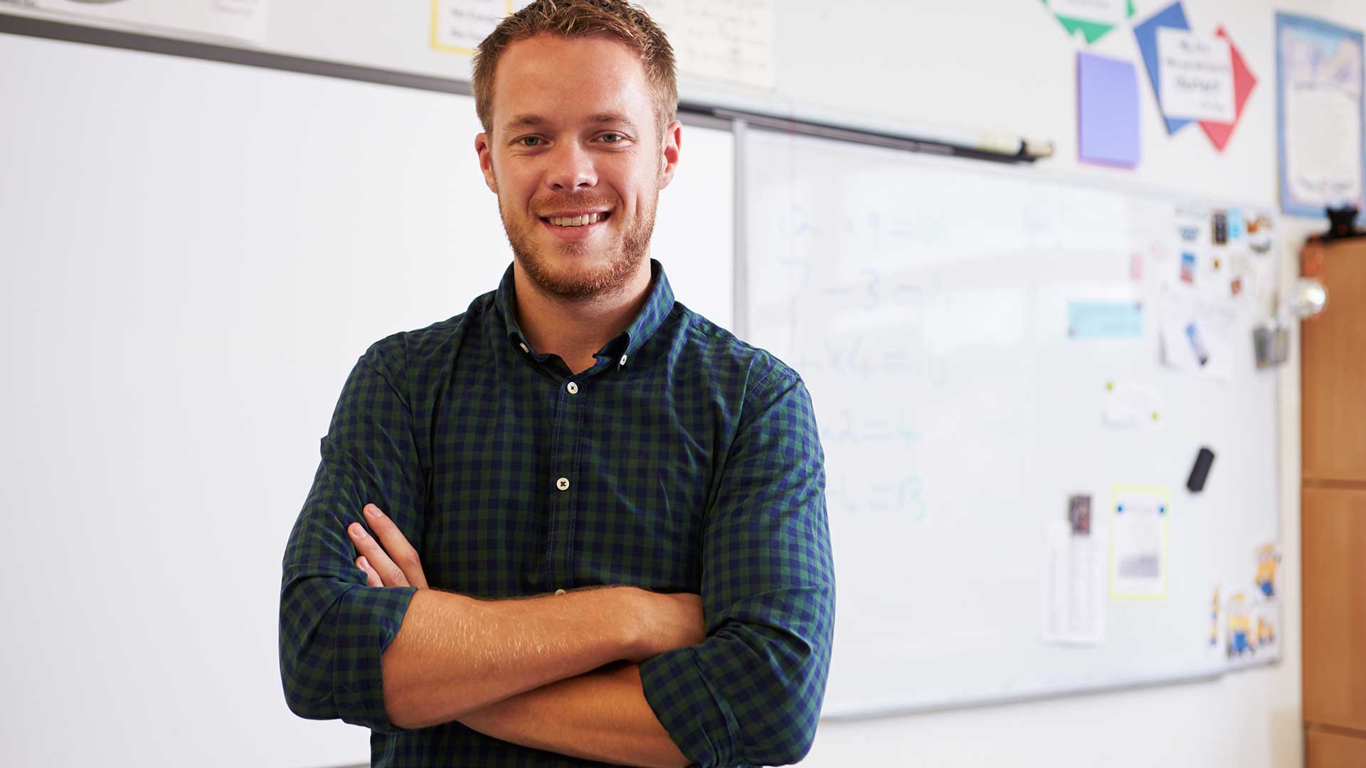 New teacher working in classroom New teacher working in classroom