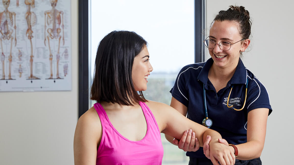 UC physiotherapy student providing treatment to young woman UC physiotherapy student providing treatment to young woman