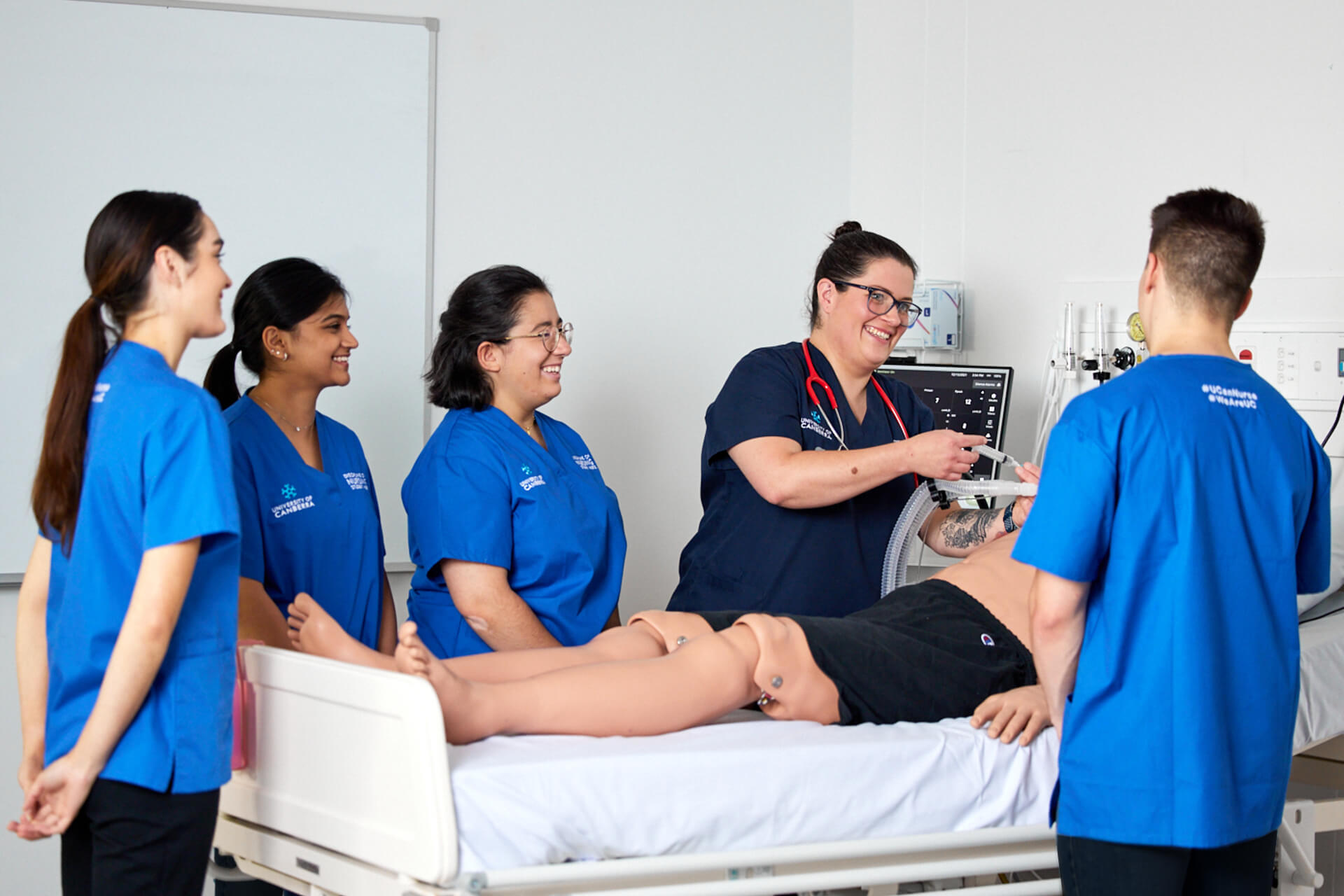 four UC nursing students learning from educator in simulated learning environment four UC nursing students learning from educator in simulated learning environment