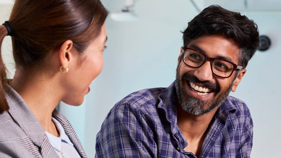 man smiling in a technology lab