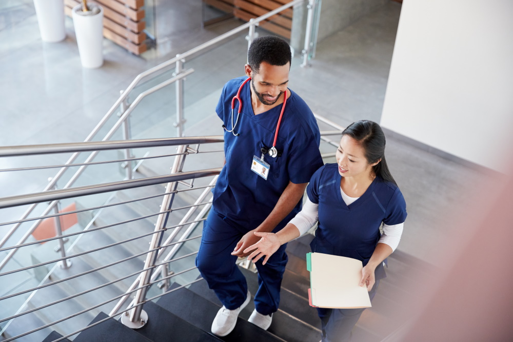 Two nursing students walking up stairs