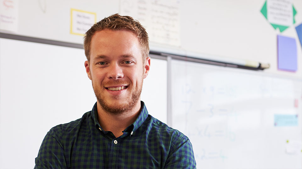 Male teacher in classroom